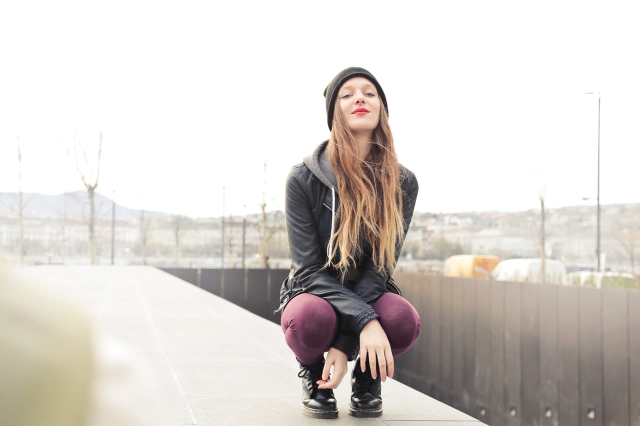 selective-photo-of-woman-in-gray-hooded-jacket-doing-crouch-790357